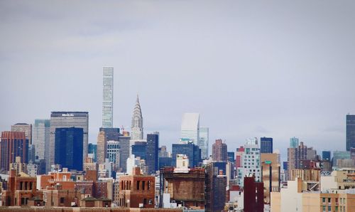 Modern buildings in city against sky