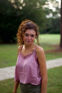 Portrait of a smiling girl standing outdoors