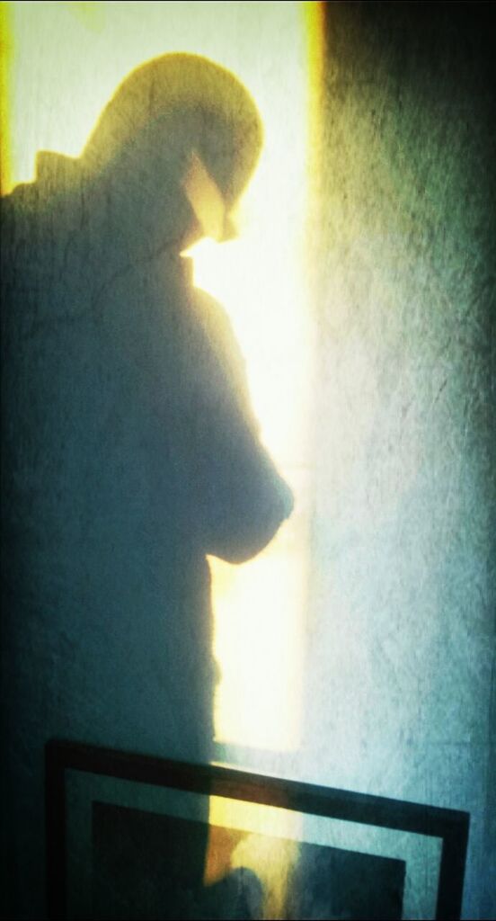 indoors, person, lifestyles, human finger, part of, side view, silhouette, cropped, men, sunlight, close-up, unrecognizable person, home interior, leisure activity, wall - building feature, holding, window