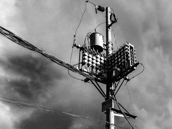 Low angle view of street light against sky