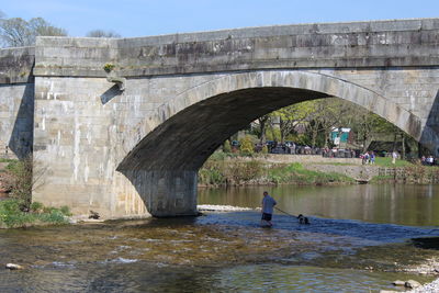 Arch bridge over river