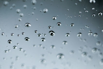 Full frame shot of raindrops on glass