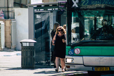 Portrait of man standing in bus