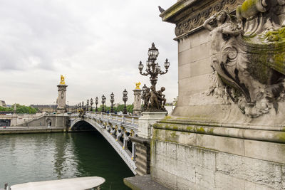 Lateral view of alexander golden bridge over the seine river in paris