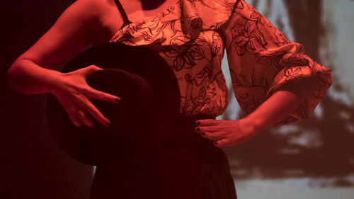Midsection of woman dancing on stage
