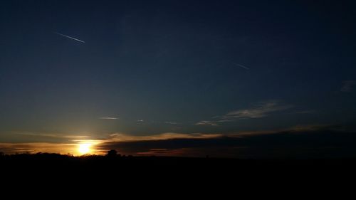 Silhouette landscape against sky during sunset