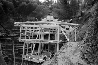 View of abandoned bridge in forest