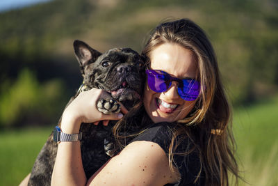 Beautiful woman with her pet french bulldog