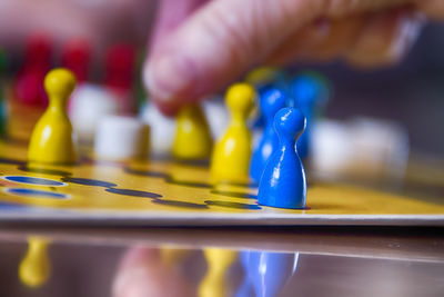 Close-up of person playing on glass