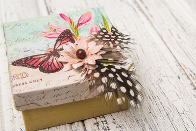 High angle view of butterfly on white table