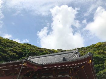 Panoramic view of temple and building against sky