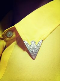 Close-up high angle view of yellow paper