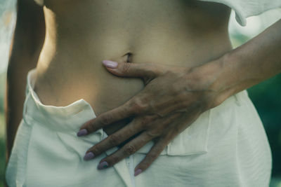 Midsection of man holding hands