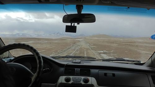 Road seen through train windshield