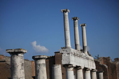 Low angle view of smoke stack against sky