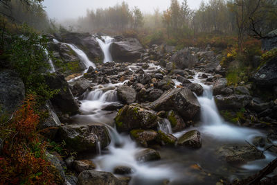 Stream flowing through rocks