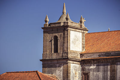 Low angle view of building against blue sky