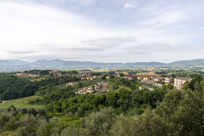 High angle view of townscape and trees against sky