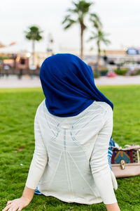 Rear view of woman on field