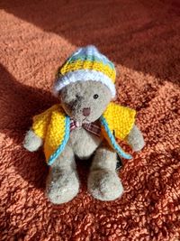 Close-up of stuffed toy against gray background