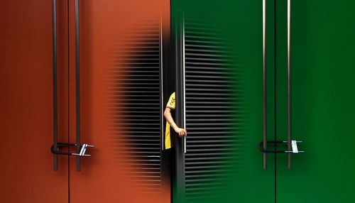 Woman standing by window