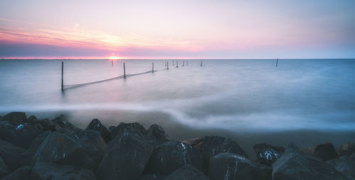 Scenic view of sea against sky during sunset