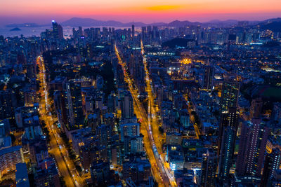 High angle view of illuminated city buildings at night