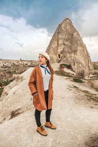 Full length of man standing on rock