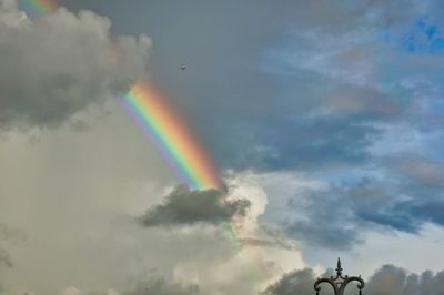 Low angle view of rainbow in sky