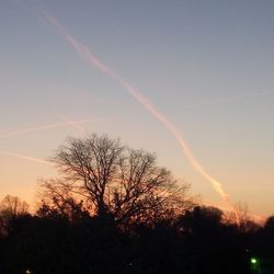 Low angle view of vapor trails in sky