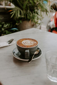 Close-up of coffee cup on table