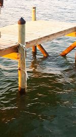 High angle view of wooden post in sea