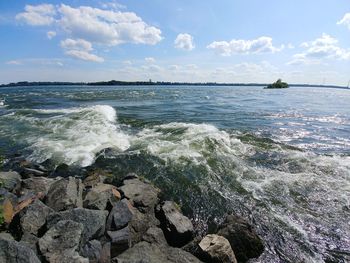 Scenic view of rapids against sky