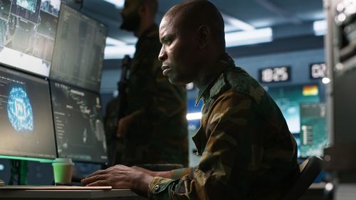 Side view of young man working in factory