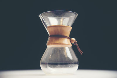 Close-up of coffee on table against black background