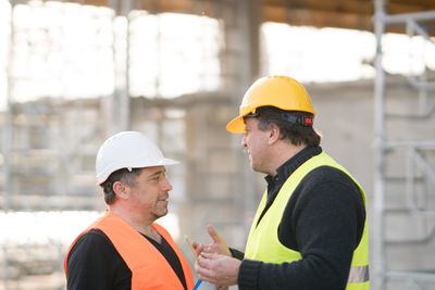 Engineers discussing at construction site