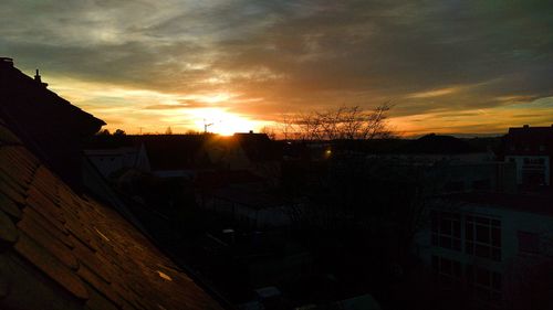 City against sky during sunset