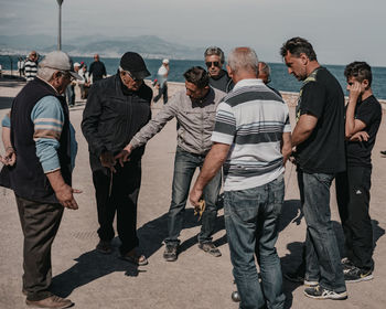 Group of people standing against the sky