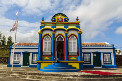 Low angle view of building against blue sky