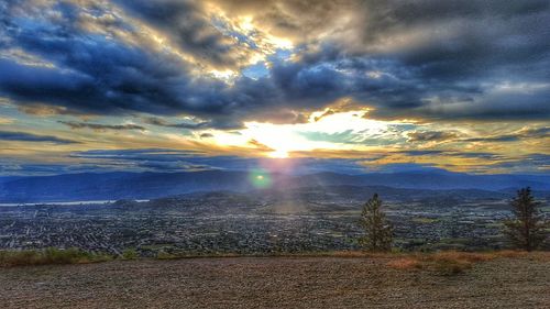 Scenic view of landscape against cloudy sky