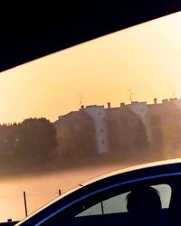 Close-up of silhouette car against sky during sunset