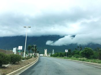 View of road against cloudy sky