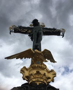 Low angle view of statue against sky