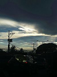 View of harbor against cloudy sky