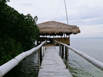 Gazebo by sea against sky