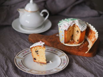 A piece homemade easter vanilla icing cream, white porcelain dish. easter food idea. tea time