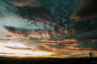 Low angle view of dramatic sky during sunset