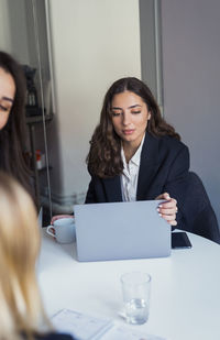 Woman using laptop in office