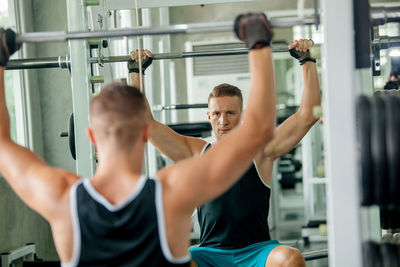 Portrait of man sitting in gym