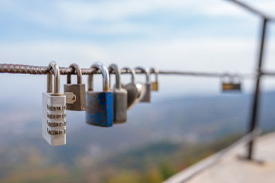 Close-up of padlocks on railing